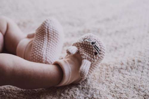 Bunny slippers on newborn’s feet 2