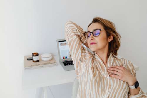 A woman works at her desk - home office