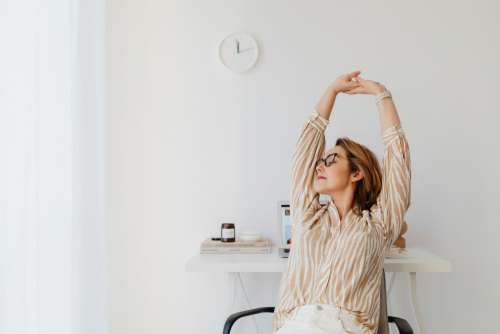 A woman works at her desk - home office