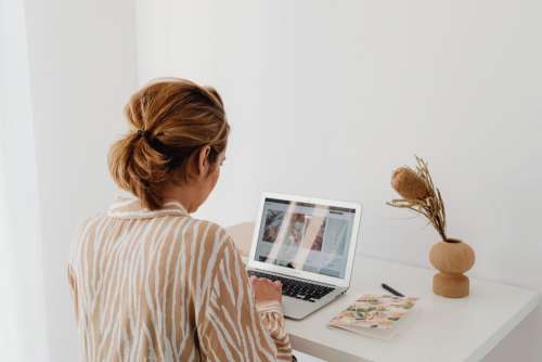 A woman works at her desk - home office