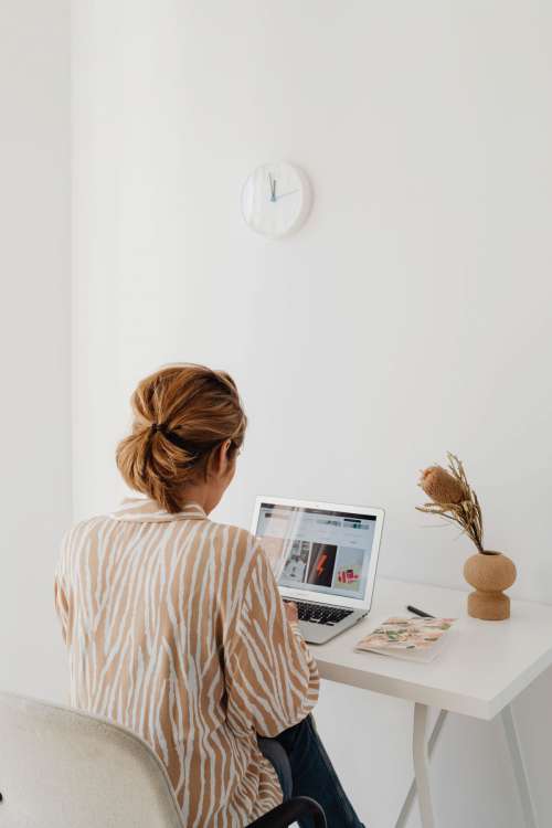 A woman works at her desk - home office