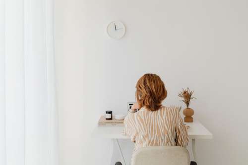 A woman works at her desk - home office