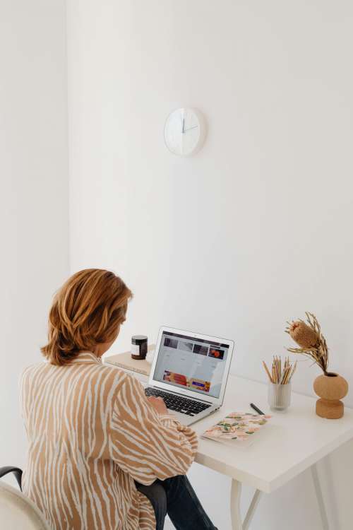 A woman works at her desk - home office