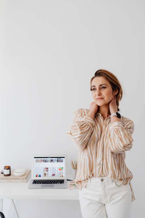 A woman works at her desk - home office