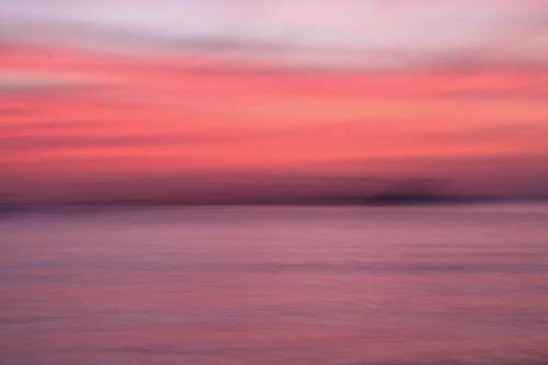 Soft Gradient Of Sunset Over Water Photo