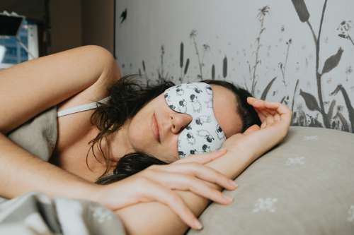 Woman Sleeps With A Facemask With Sheep On It Photo