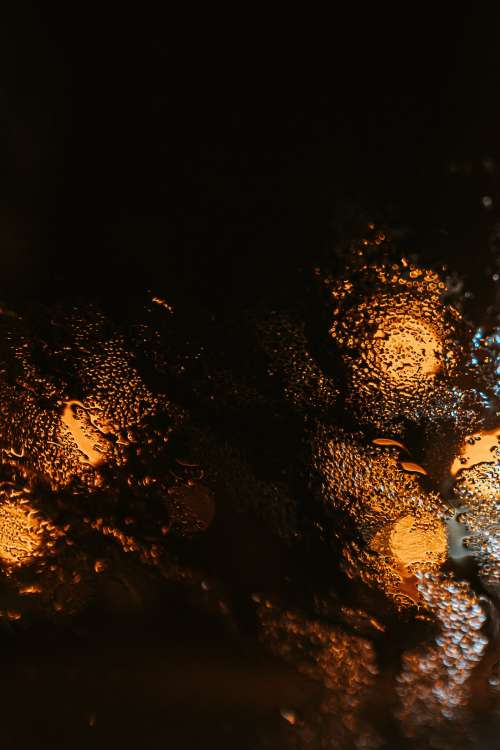 Abstract Yellow Light Through Wet Glass Photo