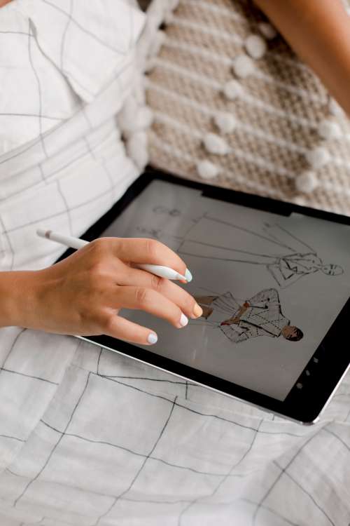 Person Working On Fashion Design On A Tablet Photo
