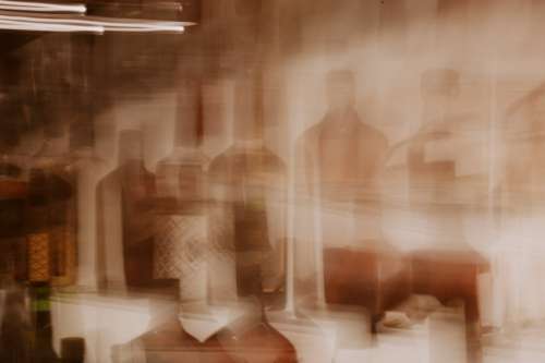 Blurry Abstract Photo Of Glass Bottles Photo