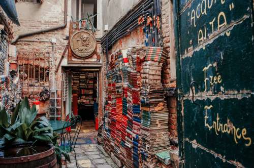 Entrance To A Bookstore With A Wall Lined With Books Photo