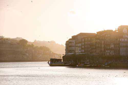 River Lined With Colorful Buildings And Boats Photo