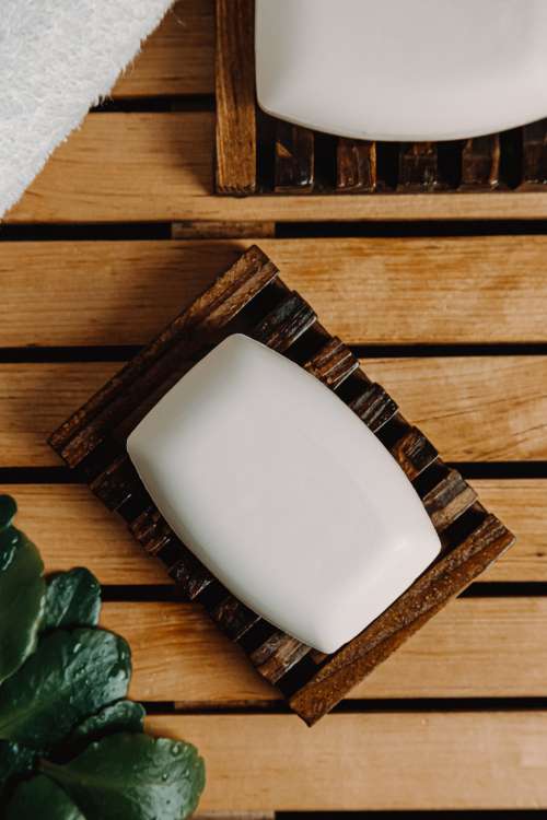 Flatlay Of Bars Of White Soap On A Wooden Surface Photo