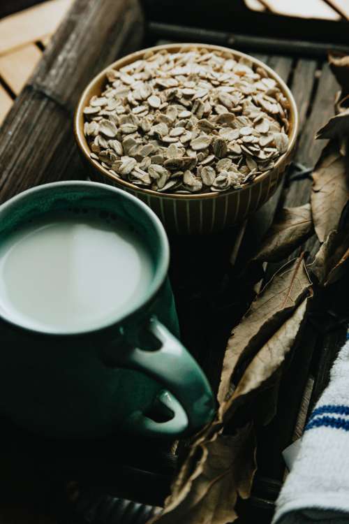 Bowl Of Oats And A Mug Of Tea On A Wooden Tray Photo
