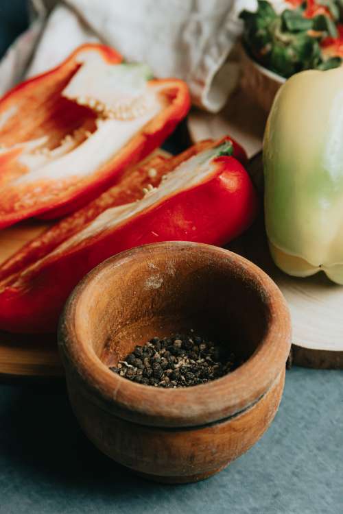 Black Pepper In A Small Wooden Bowl Photo