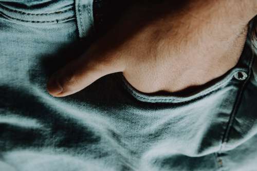 Close Up of A Hand In A Jean Pocket Photo