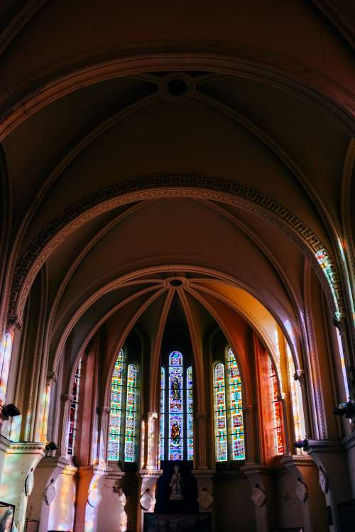 Arched Interior of A Building With Stained Glass Photo