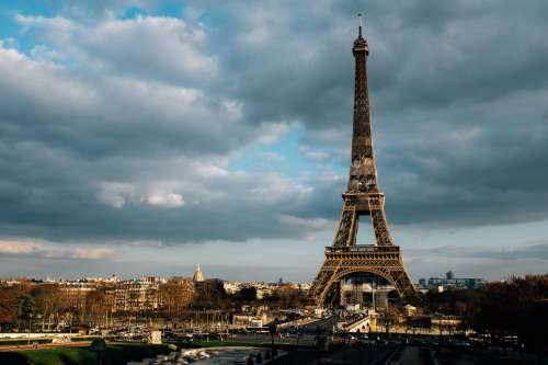 The Eiffel Tower Reaches High Against The City Of Paris Photo