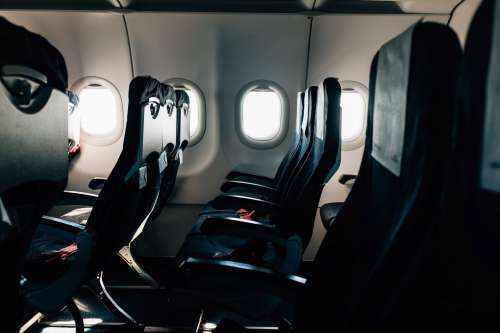 Empty Black Seats On A Commercial Airplane Photo