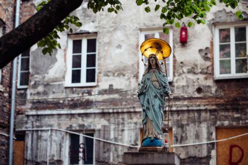 Catholic holy figure worship place outside a poor neighbourhood building 3