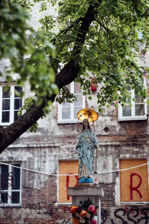 Catholic holy figure worship place outside a poor neighbourhood building 4