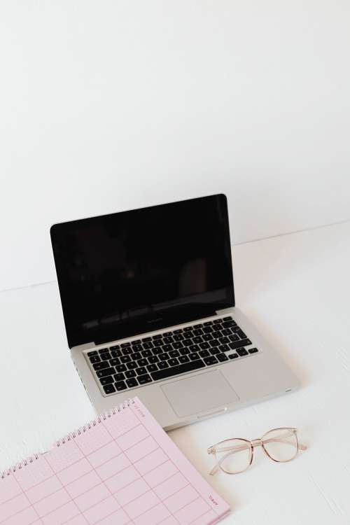 Pink calendar with planner - desk - laptop