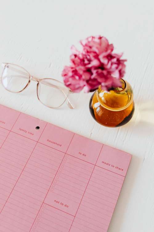 Pink calendar with planner - desk - laptop