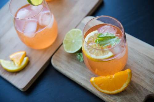 Iced Orange Drinks With Citrus Garnish Photo