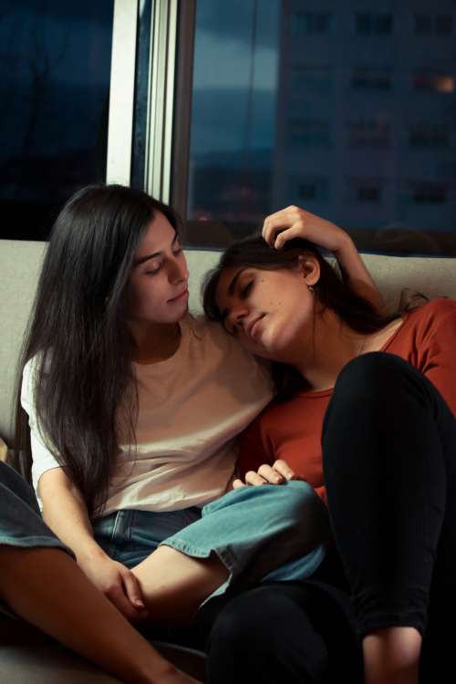 Two Women Share A Quiet Moment Together At Home Photo