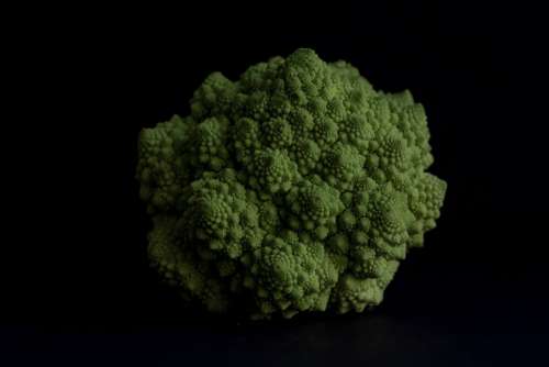 Vibrant Green Romanesco Broccoli In Centre Frame Photo