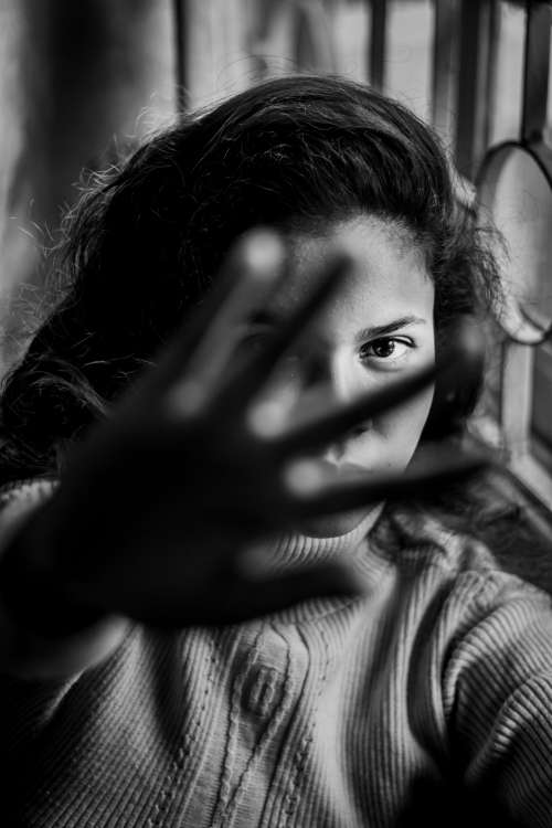 Monochrome Portrait Of Woman Holding Her Hand Out Photo