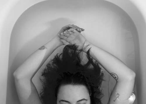Black And White Photo Of A Persons Arms In A Bath Photo