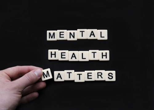 Tiles Lay On A Black Surface Reading Mental Health Matters Photo