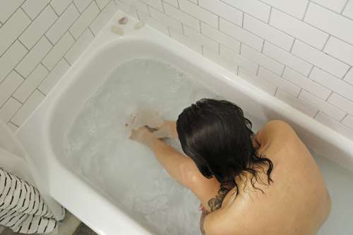 Photo Of A Person In A Bathtub Viewed From Above Photo