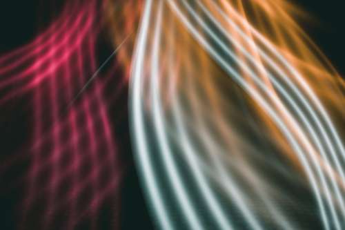 Abstract Image Of Red White And Orange Lines Curving Together Photo
