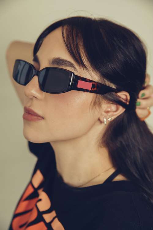 A Profile Of A Woman In Bold Black Sunglasses Photo