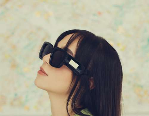 Profile Of A Woman Wearing Bold Black Sunglasses Photo