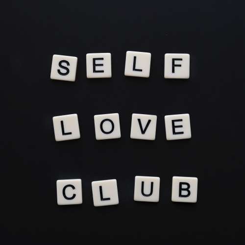White Tiles Spell Out Self Love Club Photo