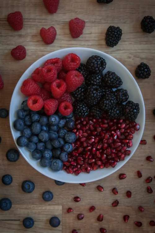Berries with pomegranate on a plate