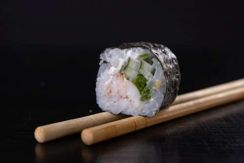 Sushi maki roll with black background