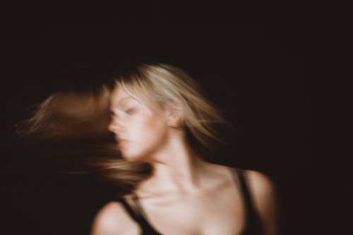 Woman With Long Blond Hair In Motion Blur Photo