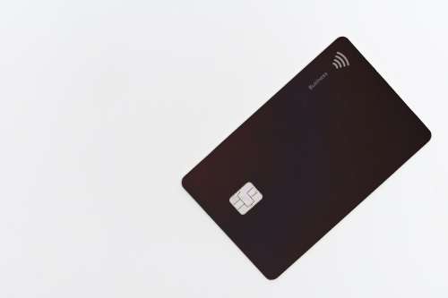 Black Plastic Debit Card On A White Table Photo