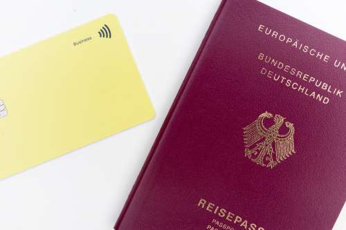 Yellow Card And A Red And Gold Passport Flatlay Photo