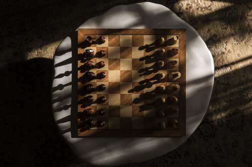 A Wooden Chess Board At The Start Of The Game Photo
