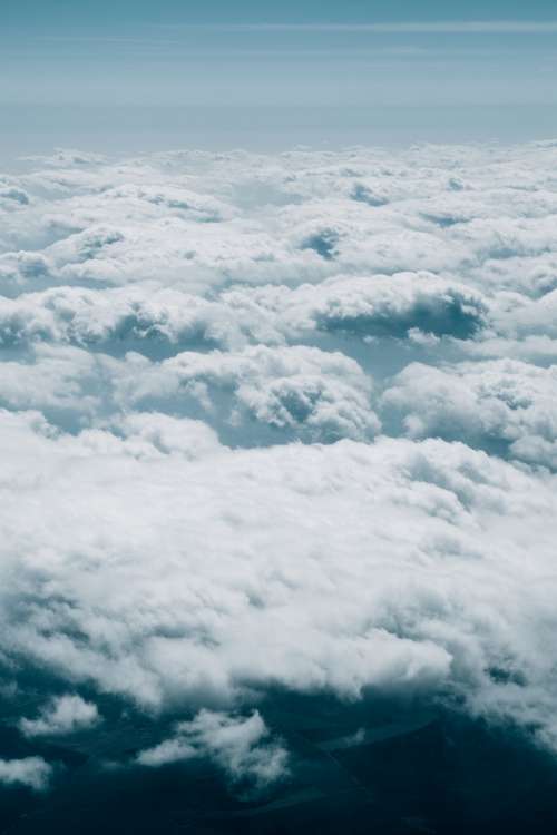 Aerial Photo Of Fluffy White Clouds Over Horizon Photo