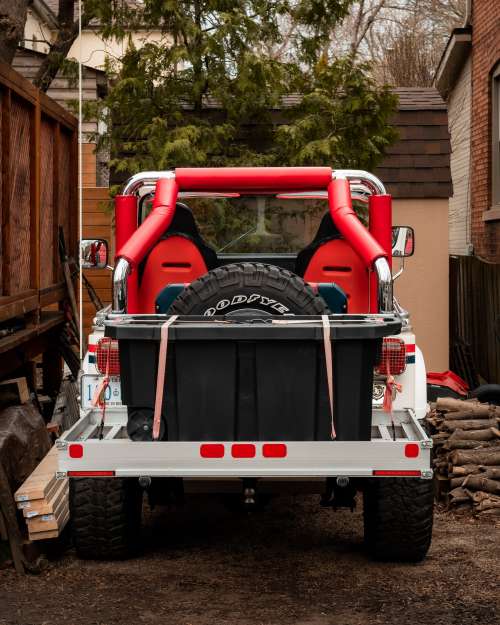 An Off Road Vehicle With Storage Strapped Down Photo