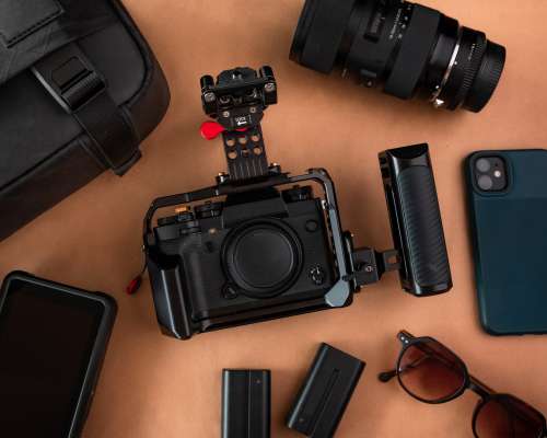 Flatlay Of A Camera Surrounded By Camera Equipment Photo