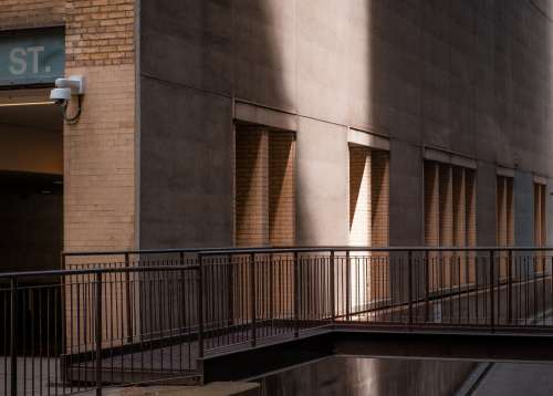 A Beam Of Light Strikes The Side Of A City Building Photo