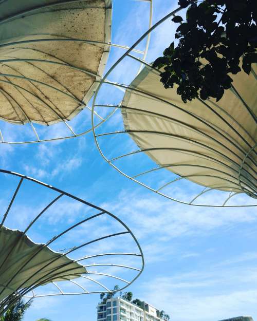 Circular Metal Structure Against A Blue Sky Photo