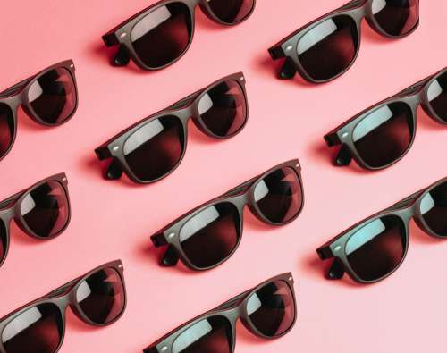 Pattern Of Black Sunglasses On Pink Photo