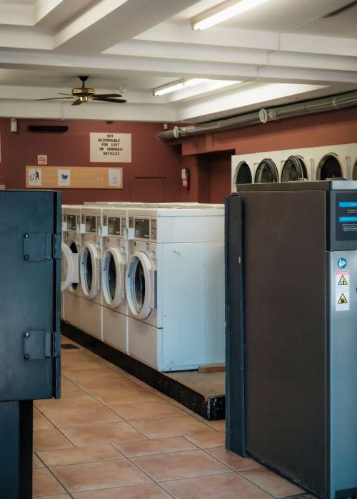 Photo Of A Laundromat With Red Walls And White Ceilings Photo